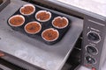 Preparing baking choco chips muffin to oven panggang adonan kue Royalty Free Stock Photo